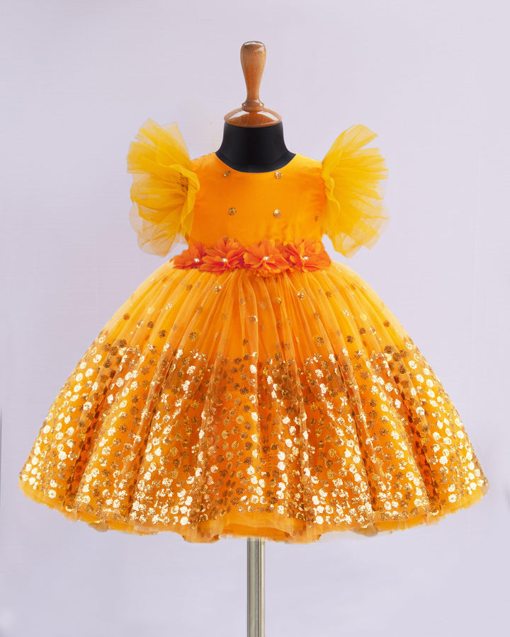 Mango Yellow Shade Heavy Sequins Party-wear Frock
Material : Mango Yellow Shade heavy sequins fabric net is used in the upper portion of the skirt. In the second layer pleated net is used for the grand and puffy lo