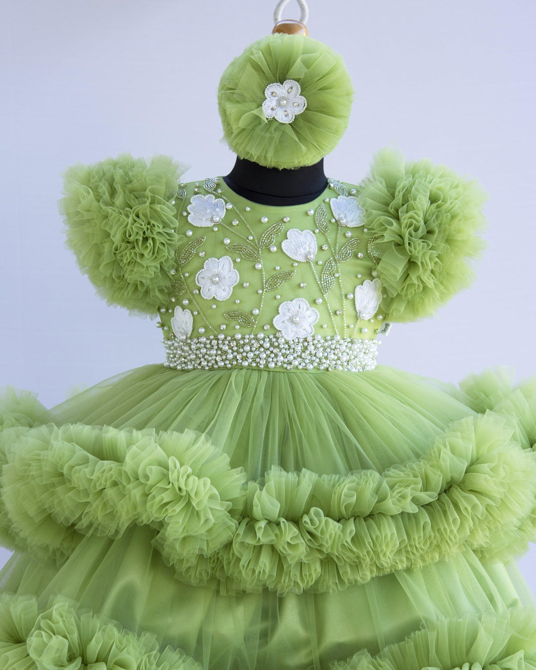 Pista Green Shade Handwork Heavy Ruffles Baby-Girls Partywear Frock
Material: Pista Green shade handwork baby-girls step frock is made with soft mono nylon net fabric. Yoke part is designed with white flower and beads handwork. Whi