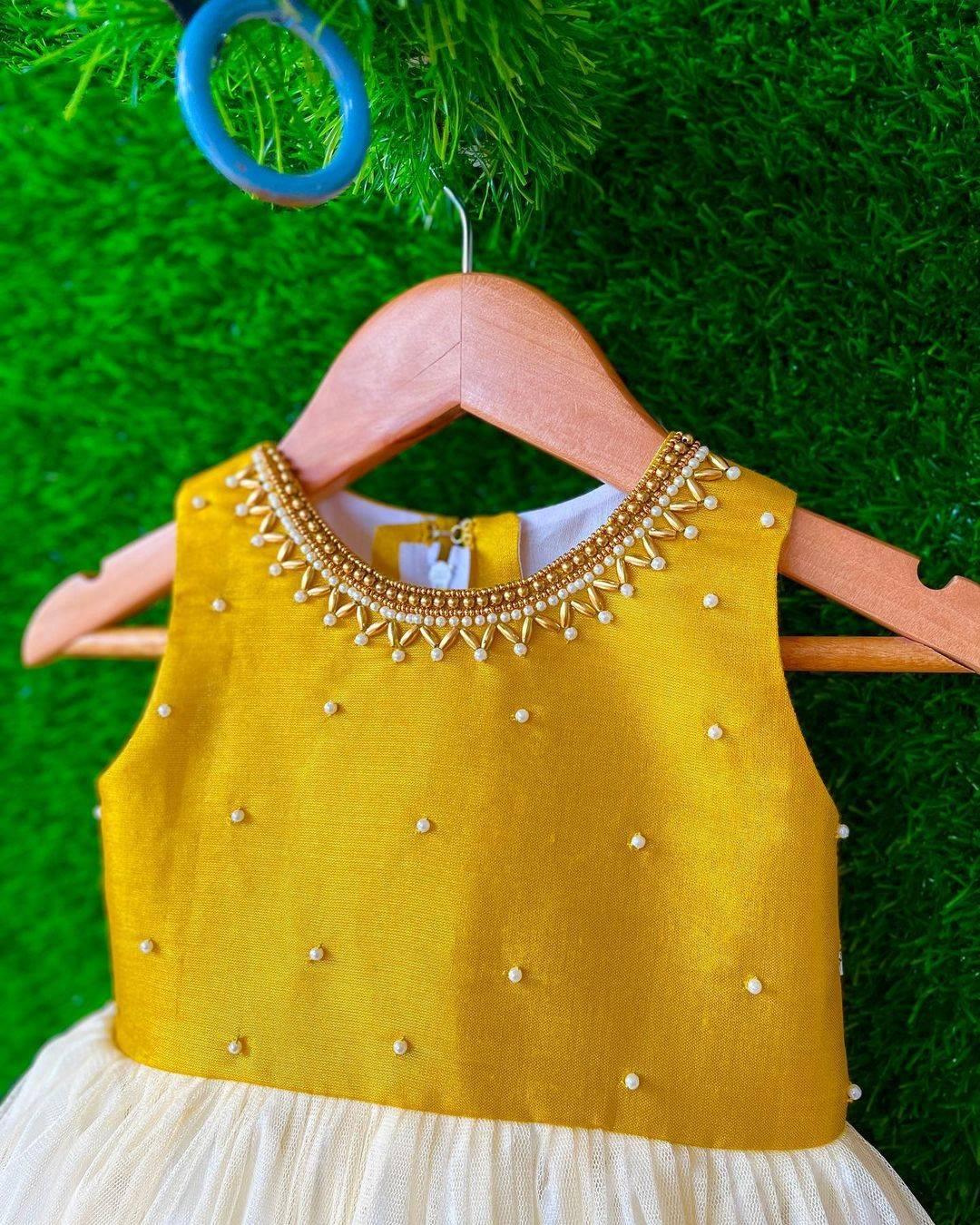 Cream & Gold handwork Traditional Knee Length Frock
Material:  Cream & Gold soft quality net with premium cream ultra satin inside for shining, Meroon silk material with hand embroidery beads on the neck and body