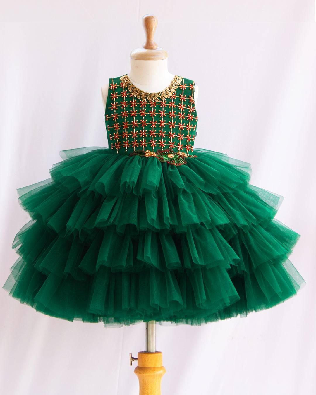 Bottle Green Hand Embroidery Layer Frock
Material: Bottle Green shade mono nylon soft net fabric layered with premium ultra satin is used for shining. Yoke portion is fully hand worked with reddish meroon