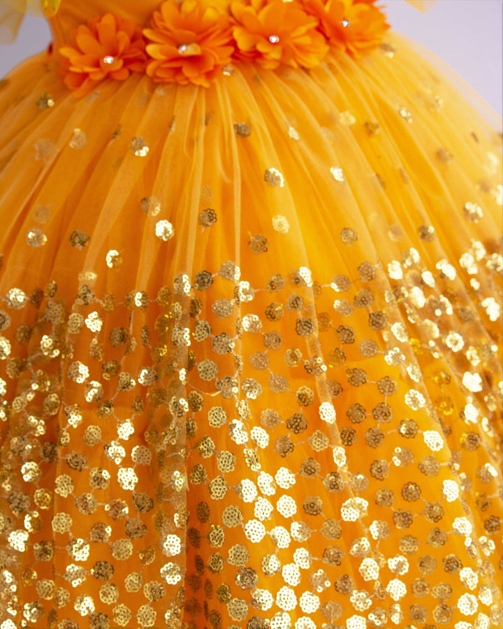 Mango Yellow Shade Heavy Sequins Party-wear Frock
Material : Mango Yellow Shade heavy sequins fabric net is used in the upper portion of the skirt. In the second layer pleated net is used for the grand and puffy lo
