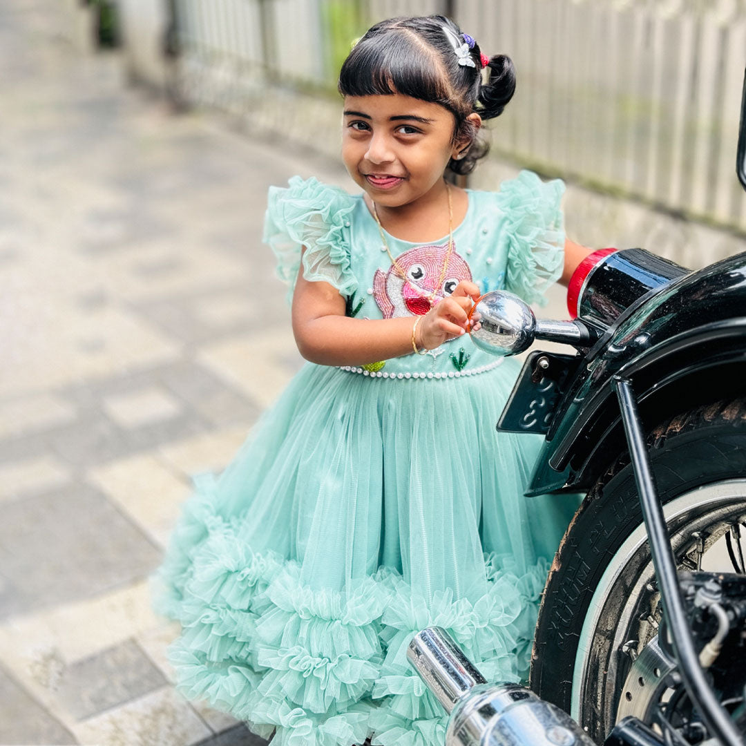 Pastel green baby shark ruffles birthday frock for baby girls.