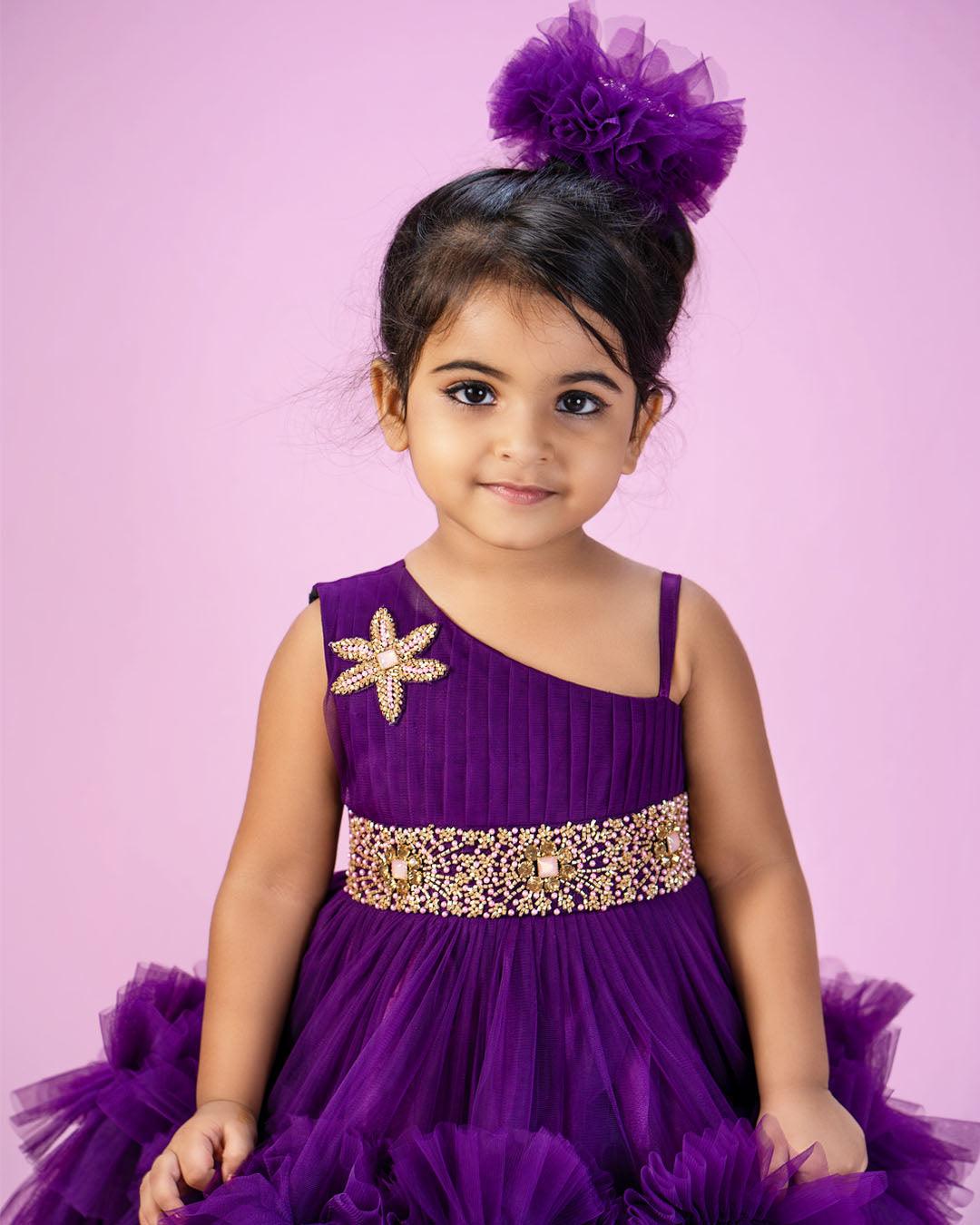 Purple Shade Pleated Ruffled Frock
Material: Purple Shade Pleated Ruffled Frock mono net with layered and ruffles on the end portion. Yoke portion is designed with pleated pattern and a handwork in t