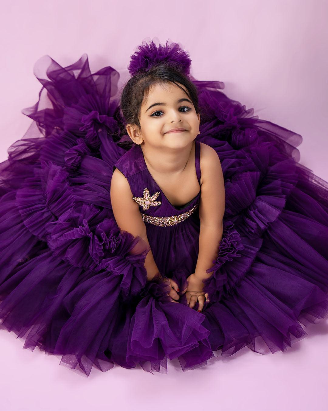 Purple Shade Pleated Ruffled Frock
Material: Purple Shade Pleated Ruffled Frock mono net with layered and ruffles on the end portion. Yoke portion is designed with pleated pattern and a handwork in t