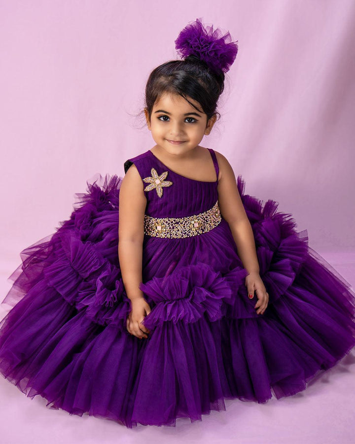 Purple Shade Pleated Ruffled Frock
Material: Purple Shade Pleated Ruffled Frock mono net with layered and ruffles on the end portion. Yoke portion is designed with pleated pattern and a handwork in t