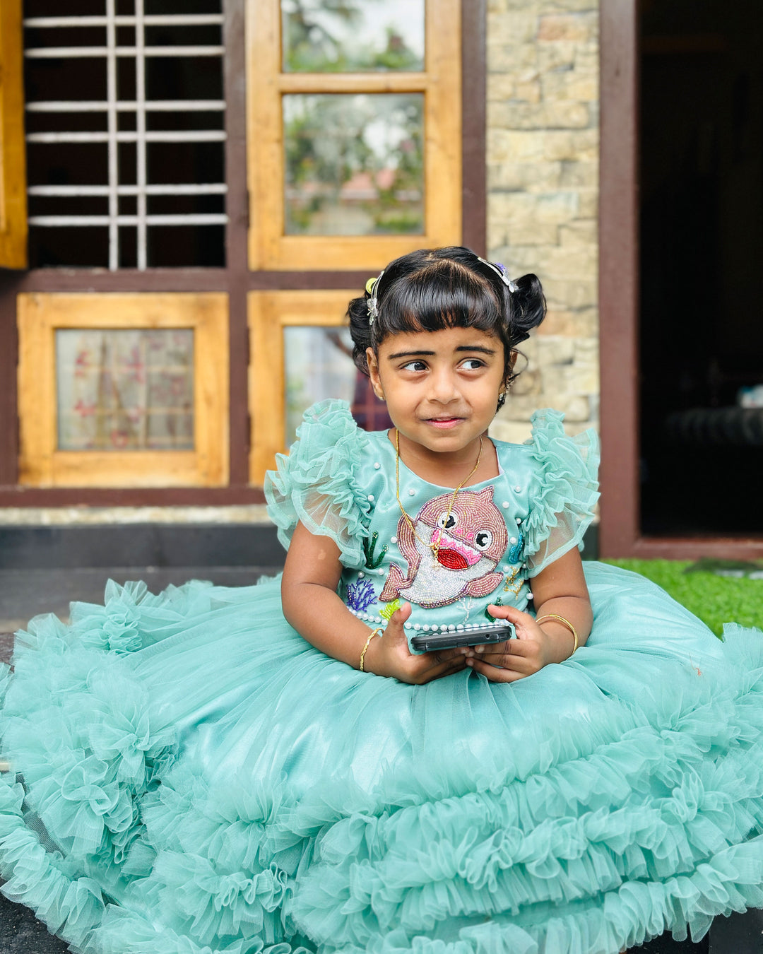 Pastel green baby shark ruffles birthday frock for baby girls.