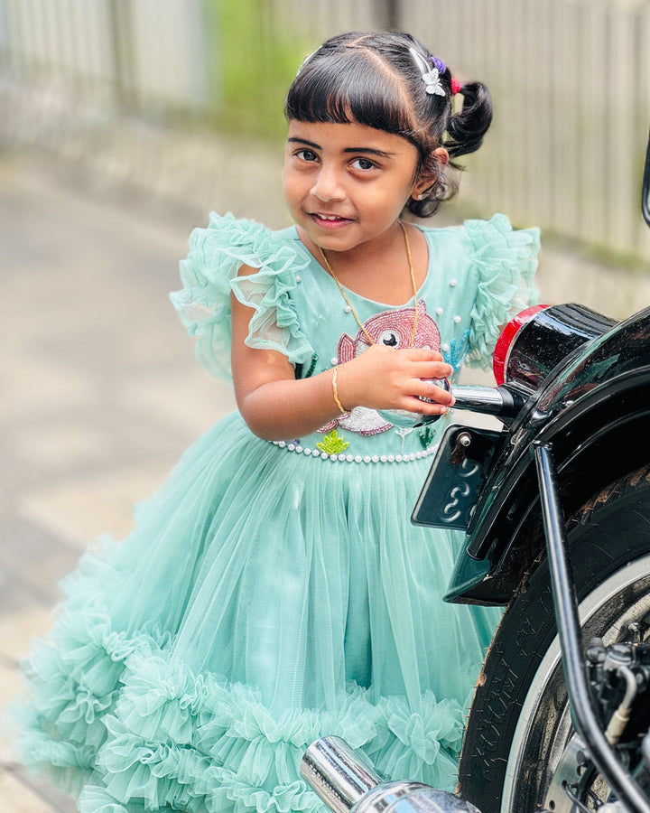 Pastel green baby shark ruffles birthday frock for baby girls.