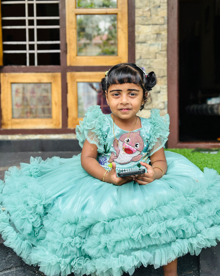 Pastel green baby shark ruffles birthday frock for baby girls.