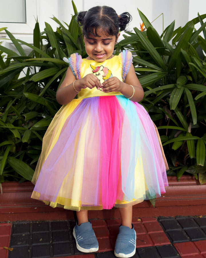 Rainbow unicorn multi-shade party wear frock for baby girls' birthday.