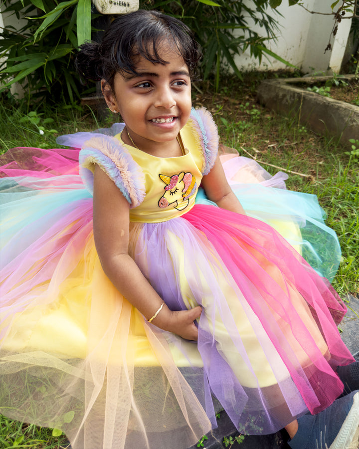 Rainbow unicorn multi-shade party wear frock for baby girls' birthday.
