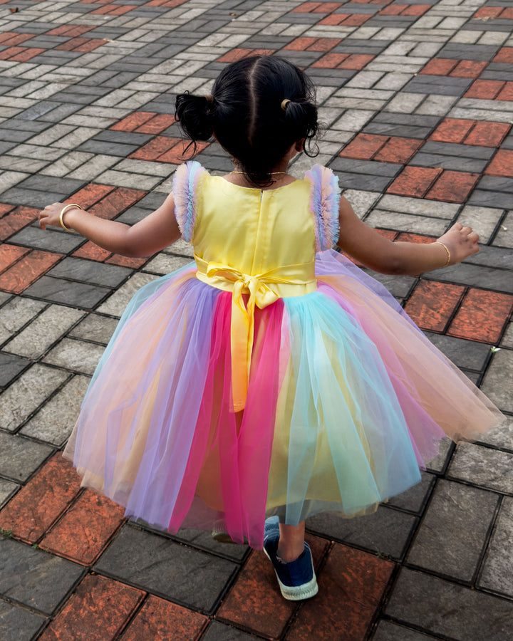 Rainbow unicorn multi-shade party wear frock for baby girls' birthday.