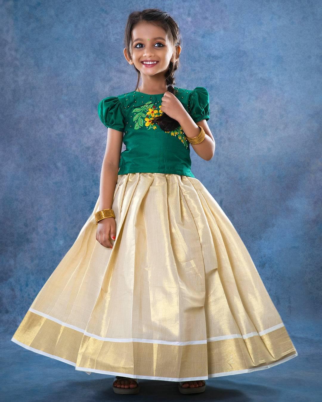 Cream & GreenTraditional Handwork Embroidery Lehenga Choli
Material: Cream colour kerala soft tissue silk fabric with dark green shade slub silk fabric with one side hand embroidery pattern and highlighted with glass beads