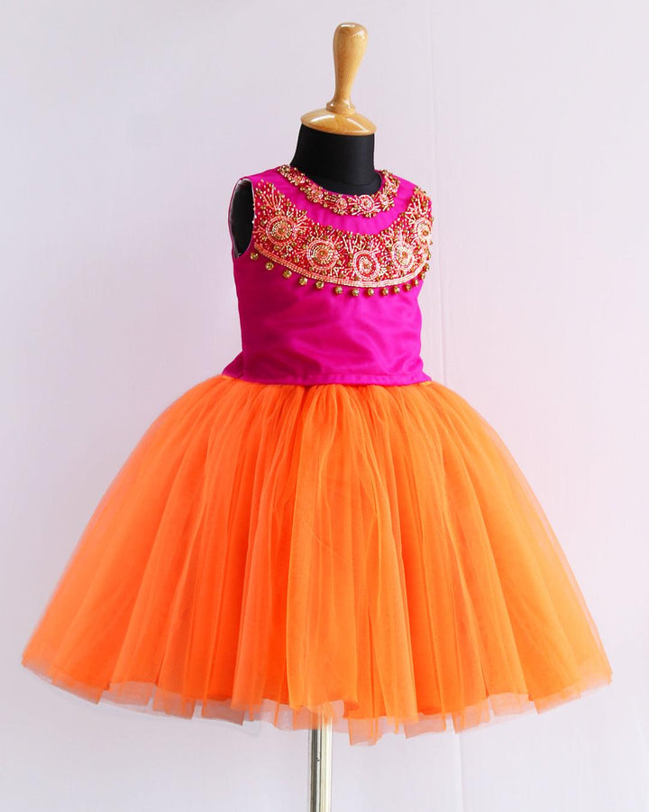Orange & Magenta combo Heavy Handwork Skirt & Top
Material: Orange & Magenta combo soft nylon net is used for making this beautiful skirt & top .Top portion of the dress is designed with magenta colour net