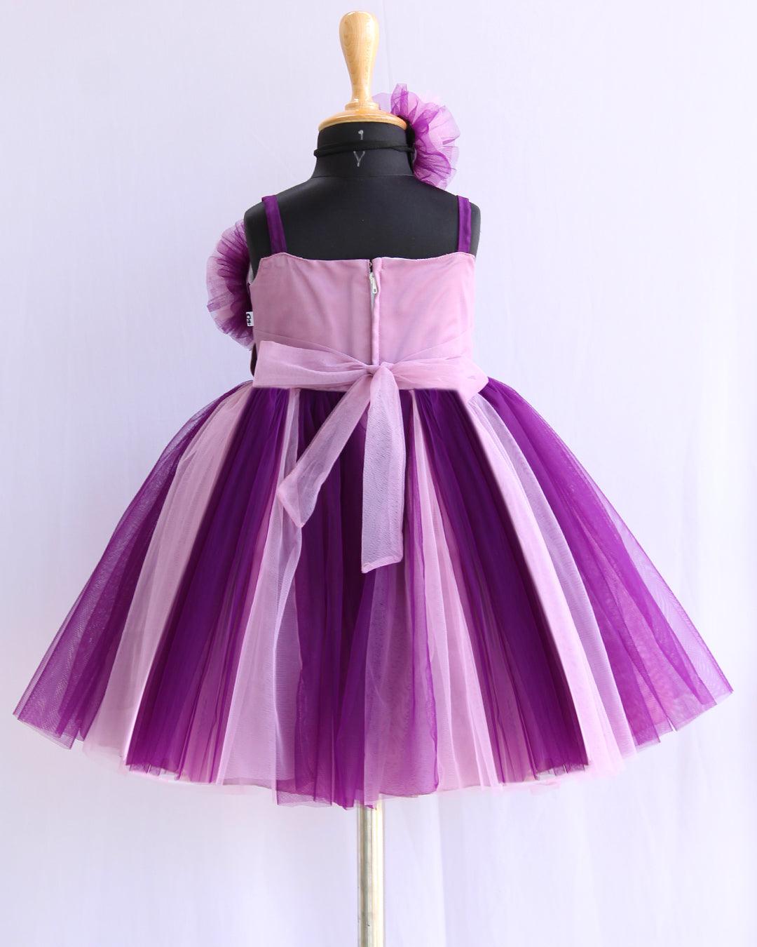 Purple & Pastel Pink Double Shade Layered Frock
Material: Purple and Pastel pink nylon net is used as in the skirt and yoke part of the dress. In the yoke portion two colours are given in a weaving pattern for an