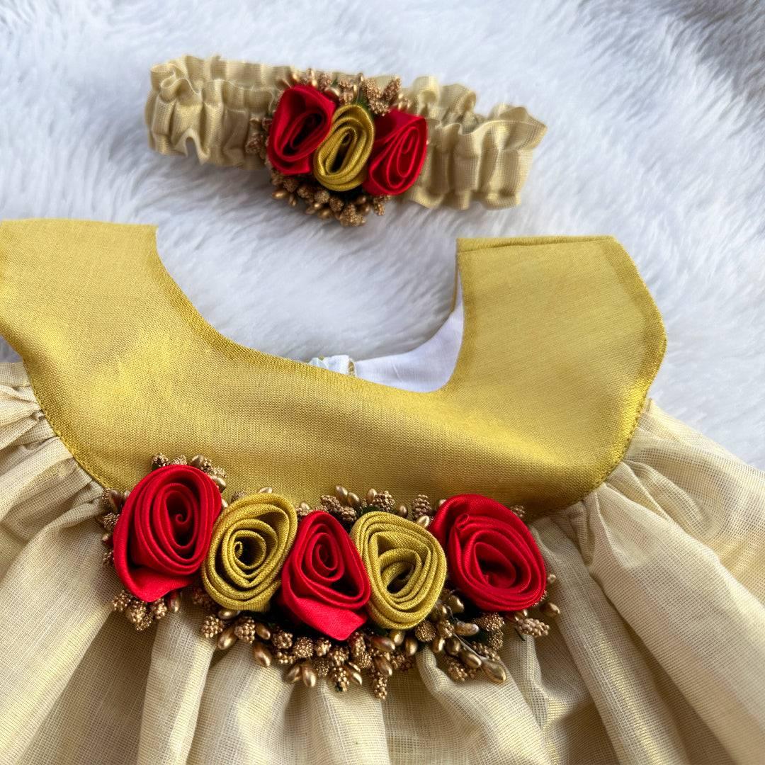 Cream & Gold Kerala Traditional Tissue frock - Matching Hairbad
Material: Cream shade kerala kasavu handloom fabric. Center portion is highlighted with red & golden flowers with pollens attached. Beautifully designed outfit
