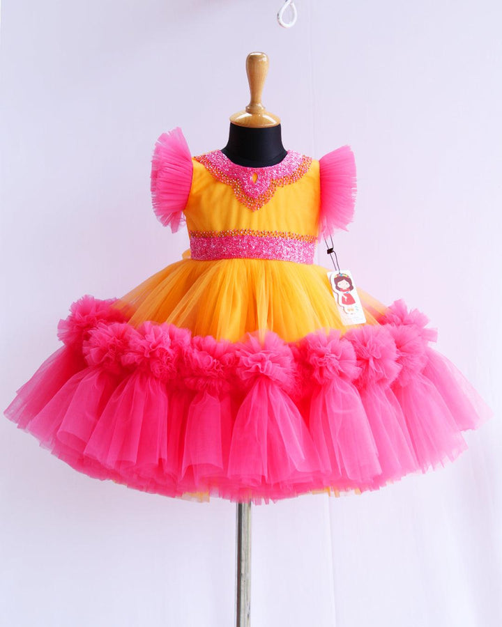 Sun Yellow & Peach Flarred Handwork Frock
Material: Sun Yellow & Peach soft nylon net is used for making this beautiful frock.Yoke portion of the frock is designed with yellow net with peach and golden