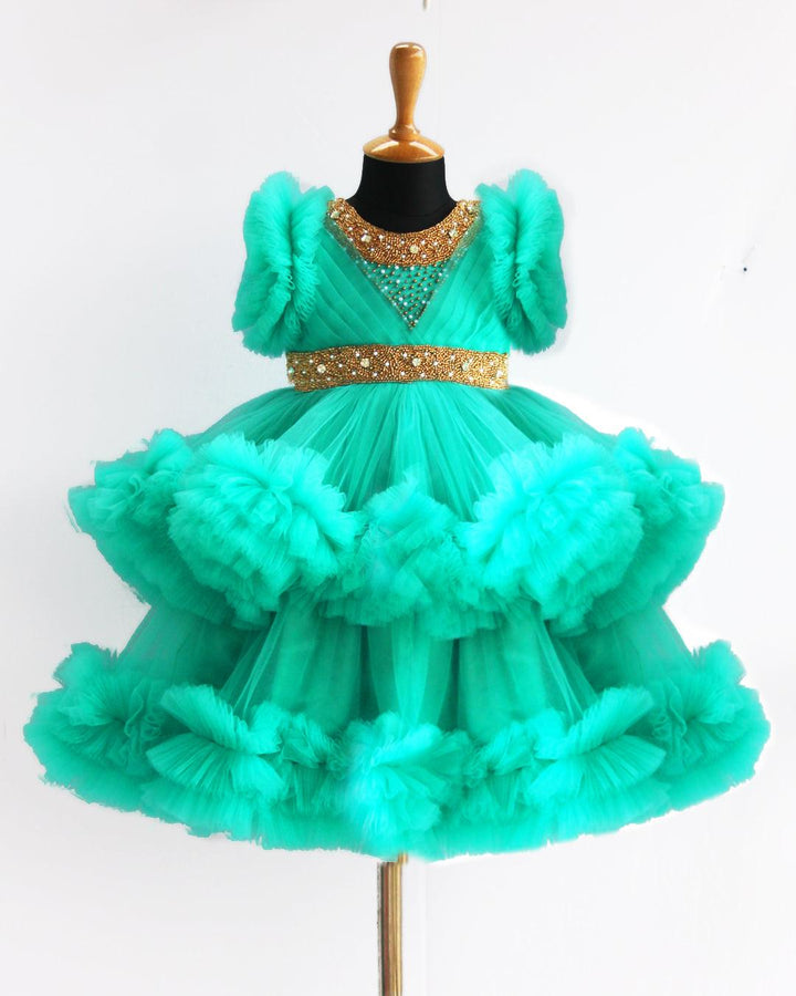 Sea Green Handwork Two Layer Ruffled Frock
Material: Sea Green Shade Pleated Ruffled Frock mono net with layered and ruffles on the end portion. Yoke portion is designed with pleated pattern and golden beade