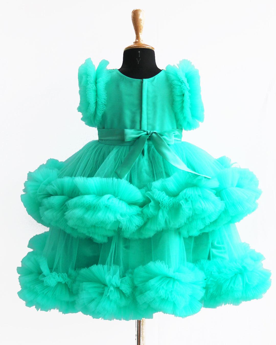Sea Green Handwork Two Layer Ruffled Frock
Material: Sea Green Shade Pleated Ruffled Frock mono net with layered and ruffles on the end portion. Yoke portion is designed with pleated pattern and golden beade