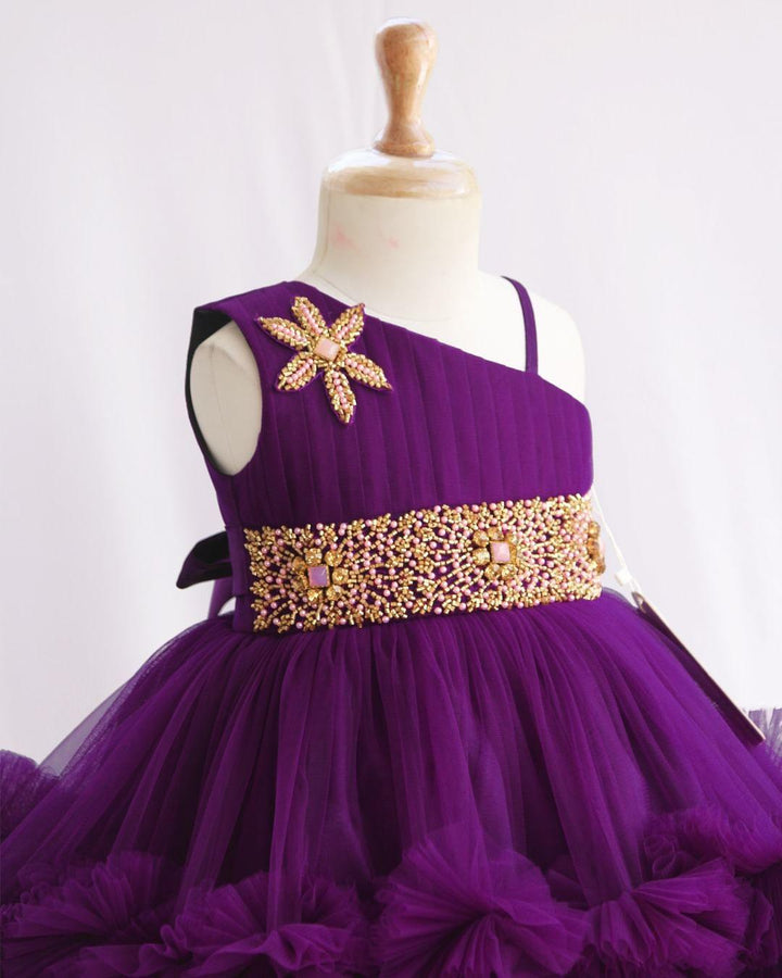 Purple Shade Pleated Ruffled Frock
Material: Purple Shade Pleated Ruffled Frock mono net with layered and ruffles on the end portion. Yoke portion is designed with pleated pattern and a handwork in t