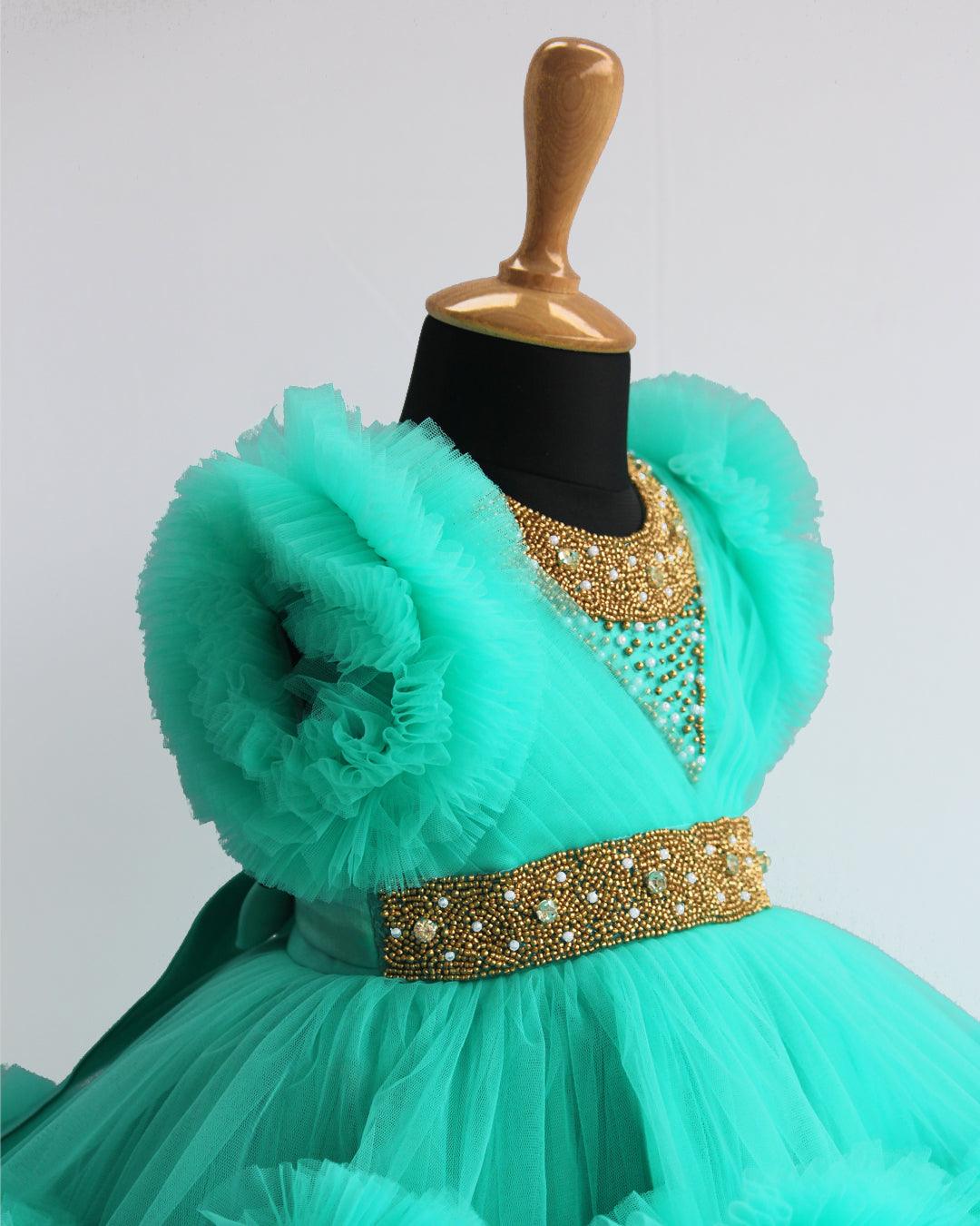 Sea Green Handwork Two Layer Ruffled Frock
Material: Sea Green Shade Pleated Ruffled Frock mono net with layered and ruffles on the end portion. Yoke portion is designed with pleated pattern and golden beade