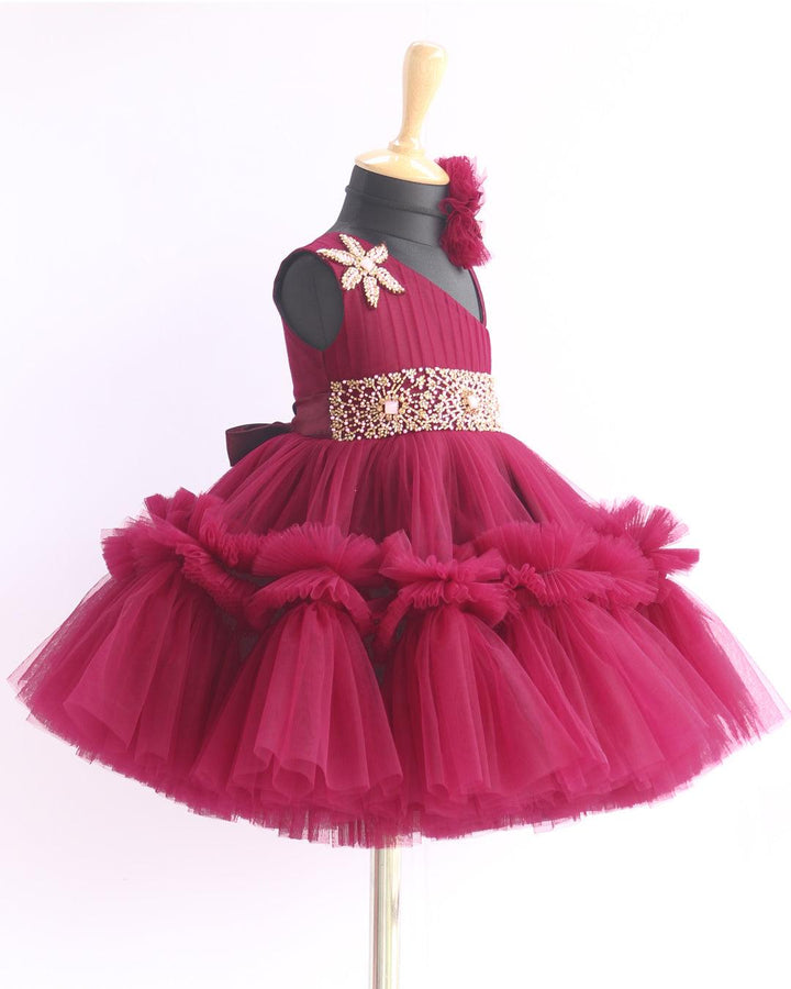 Grapevine Pleated Ruffled Birthday Frock.
Material: Aishu's Purple Shade Pleated Ruffled Frock mono net with layered and ruffles on the end portion. Yoke portion is designed with pleated pattern and a handw