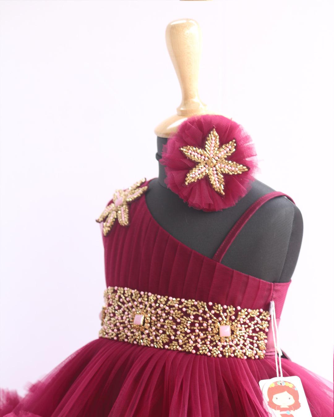 Grapevine Pleated Ruffled Birthday Frock.
Material: Aishu's Purple Shade Pleated Ruffled Frock mono net with layered and ruffles on the end portion. Yoke portion is designed with pleated pattern and a handw