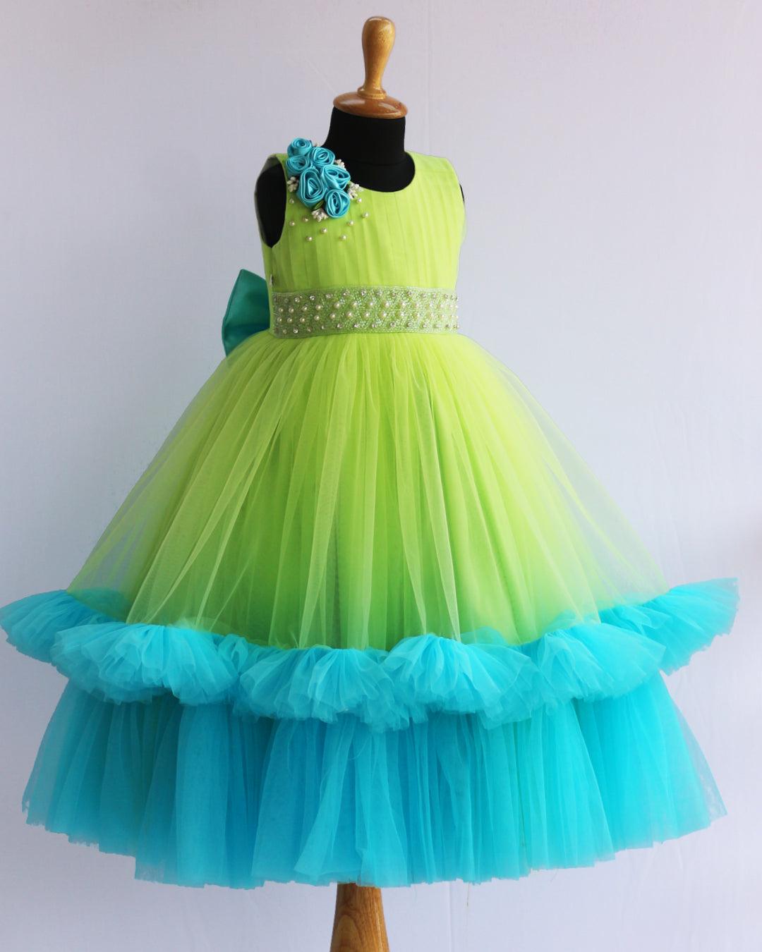 Lime Green & Skyblue Combo Pleated Ruffles Gown - Matching Hair Band
Material : Pista Green and Sky Blue combination gown. Yoke portion is done by pleated pista green net and premium quality satin is used for the primary lining. Shou