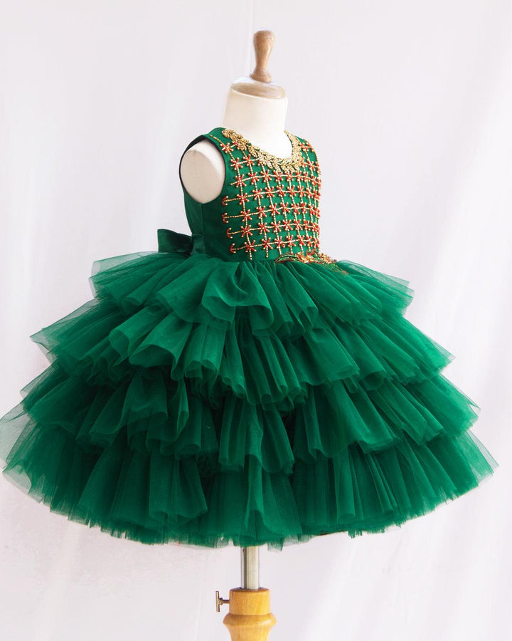 Bottle Green Hand Embroidery Layer Frock
Material: Bottle Green shade mono nylon soft net fabric layered with premium ultra satin is used for shining. Yoke portion is fully hand worked with reddish meroon