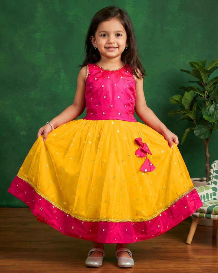 Yellow and magenta mirror work lehenga choli for baby girls

South Indian traditional birthday dress for girls

Mirror work festive wear lehenga choli

Baby girls ethnic partywear dress

Designer lehenga choli set for toddlers

Kids traditional outfit yellow magenta

Stanwells Kids festive birthday dress