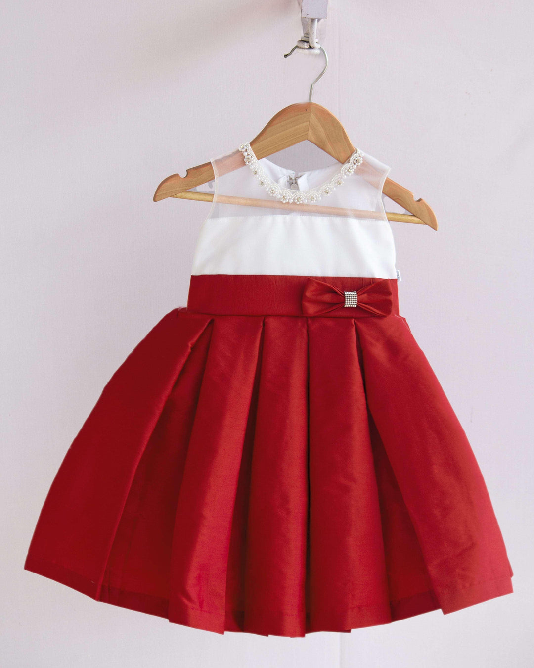 Red & White Combo Baby-Girls Box Pleated Tafetta Silk Handwork Frock
Material : Red shade party perfect box pleats frock is made with soft taffeta silk fabric. The yoke portion of the frock is designed in transparent neck design with