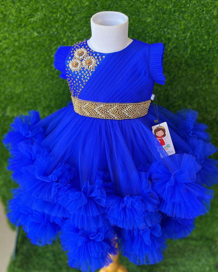 Royalblue Layered Pleated Heavy Ruffled Hand embroidery Birthday Frock

Material: Royalblue nylon mono net with layered and ruffles on the end portion. Yoke portion is designed with pleated pattern and a handwork in the centre portion.