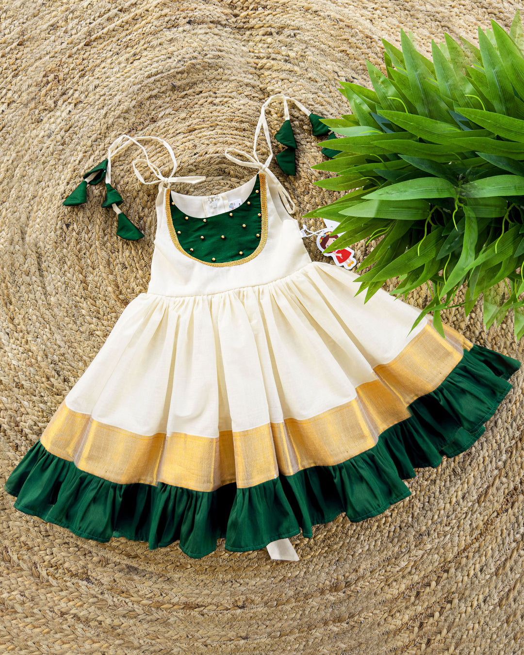 girls frocks | stanwells kids | cream frock for kids | traditional frock for kids | ethnic frocks | stanwells kids | kettuduppu for girls | noolukettu dresses | handwork frocks | green kerala dresses | kerala kasavu dresses | baby kerala dresses