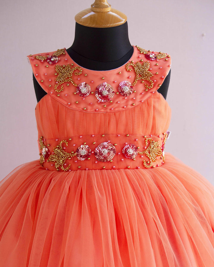 Coral Peach Shade Handwork Partywear Sleeveless Knee length Frock
Material : Coral Peach shade party perfect sleeveless frock is made with soft nylon net fabric. The yoke portion of the frock is designed as open neck pattern with 