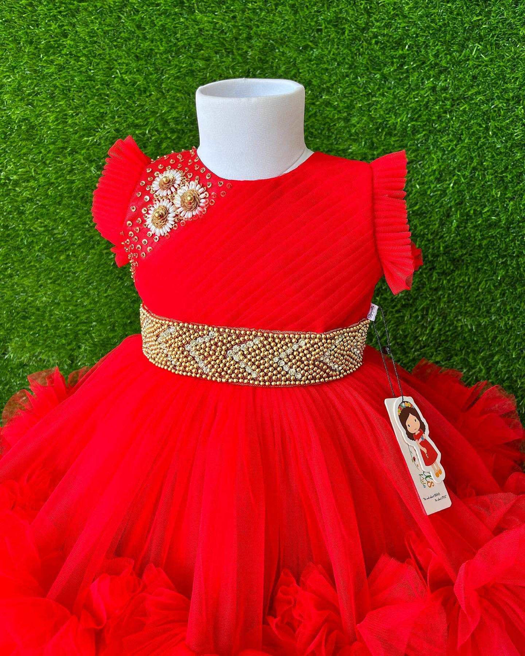 Red Layered Pleated Heavy Ruffled Hand embroidery Birthday Frock

Material: Bright red nylon mono net with layered and ruffles on the end portion. Yoke portion is designed with pleated pattern and a handwork in the centre portion