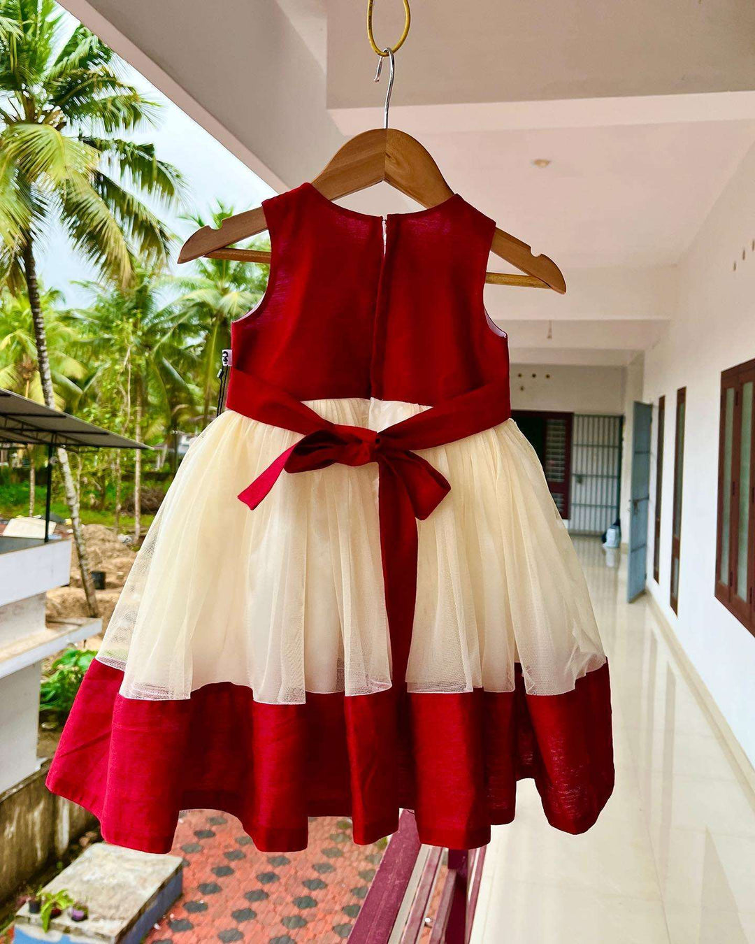 Cream & Meroon Traditional Handwork Kerala Frock
Material:  Creamish golden soft quality net with premium cream ultra satin inside for shining, Meroon silk material with hand embroidery beads on the neck and body 