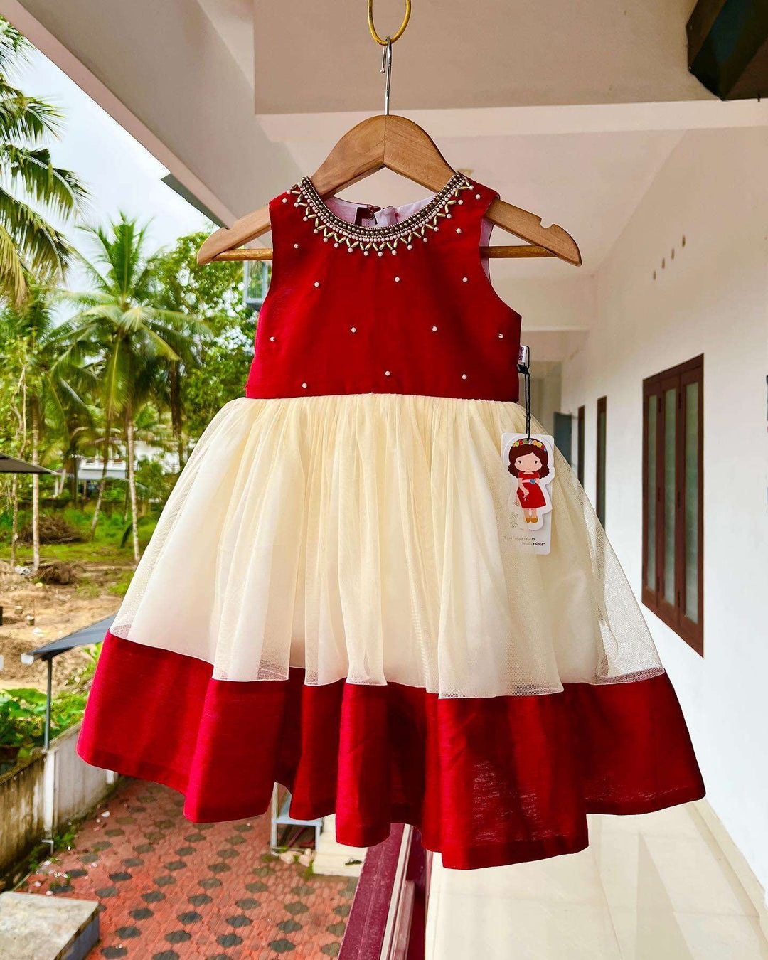 Cream & Meroon Traditional Handwork Kerala Frock
Material:  Creamish golden soft quality net with premium cream ultra satin inside for shining, Meroon silk material with hand embroidery beads on the neck and body 