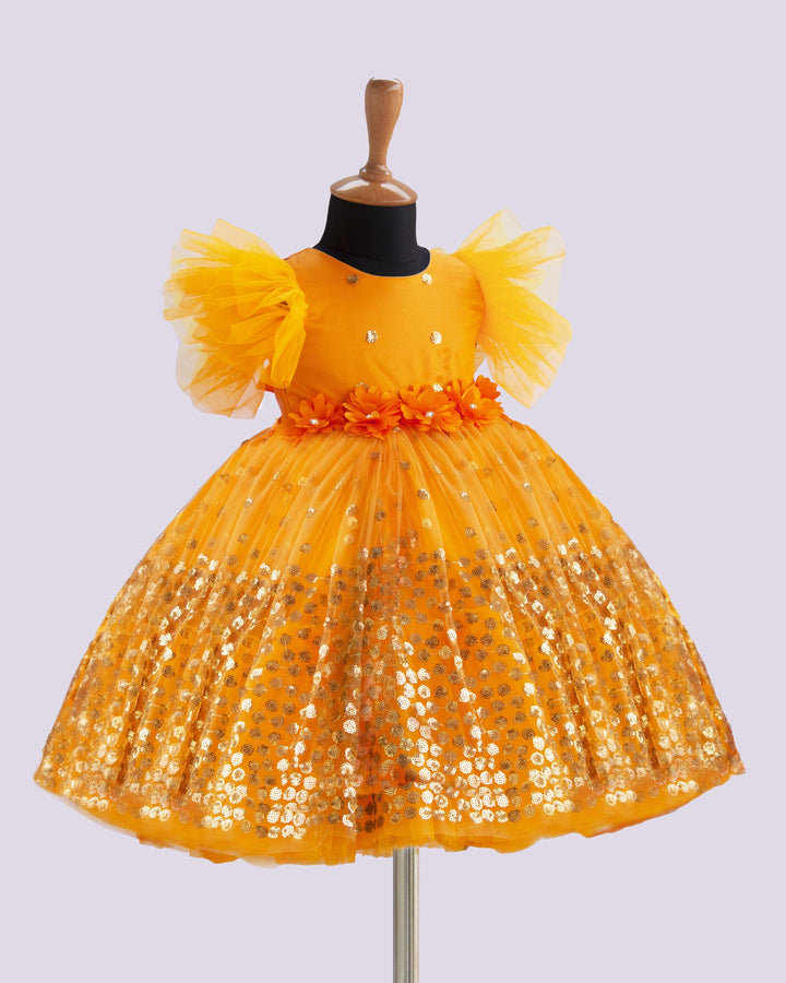 Mango Yellow Shade Heavy Sequins Party-wear Frock
Material : Mango Yellow Shade heavy sequins fabric net is used in the upper portion of the skirt. In the second layer pleated net is used for the grand and puffy lo
