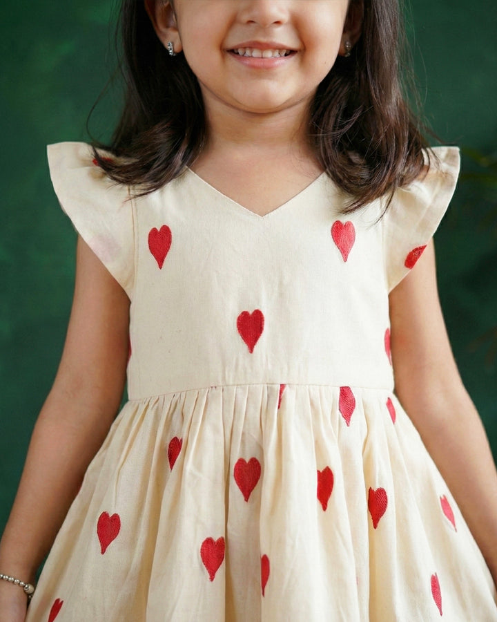 baby girls off white birthday dress

cotton birthday dress for baby girls

heart embroidery baby girl partywear dress

baby girls birthday party dress India

off white baby girl frock for birthday