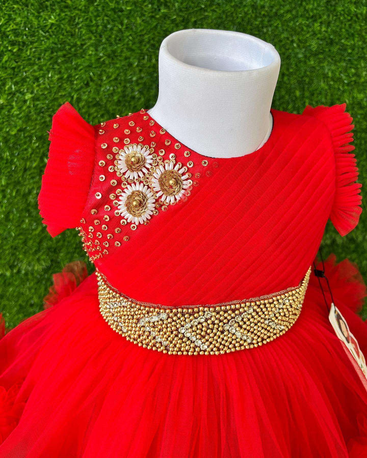 Red Layered Pleated Heavy Ruffled Hand embroidery Birthday Frock

Material: Bright red nylon mono net with layered and ruffles on the end portion. Yoke portion is designed with pleated pattern and a handwork in the centre portion