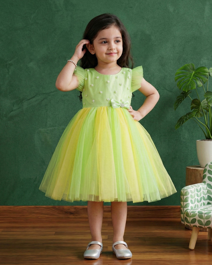 Light green and baby yellow birthday frock for baby girls

Partywear dress for girls 6M–8Y

Stylish dual-color frock for toddlers

Elegant baby girls birthday outfit

Festive wear frock for kids

Stanwells Kids yellow green party dress

Designer birthday frock for baby girls