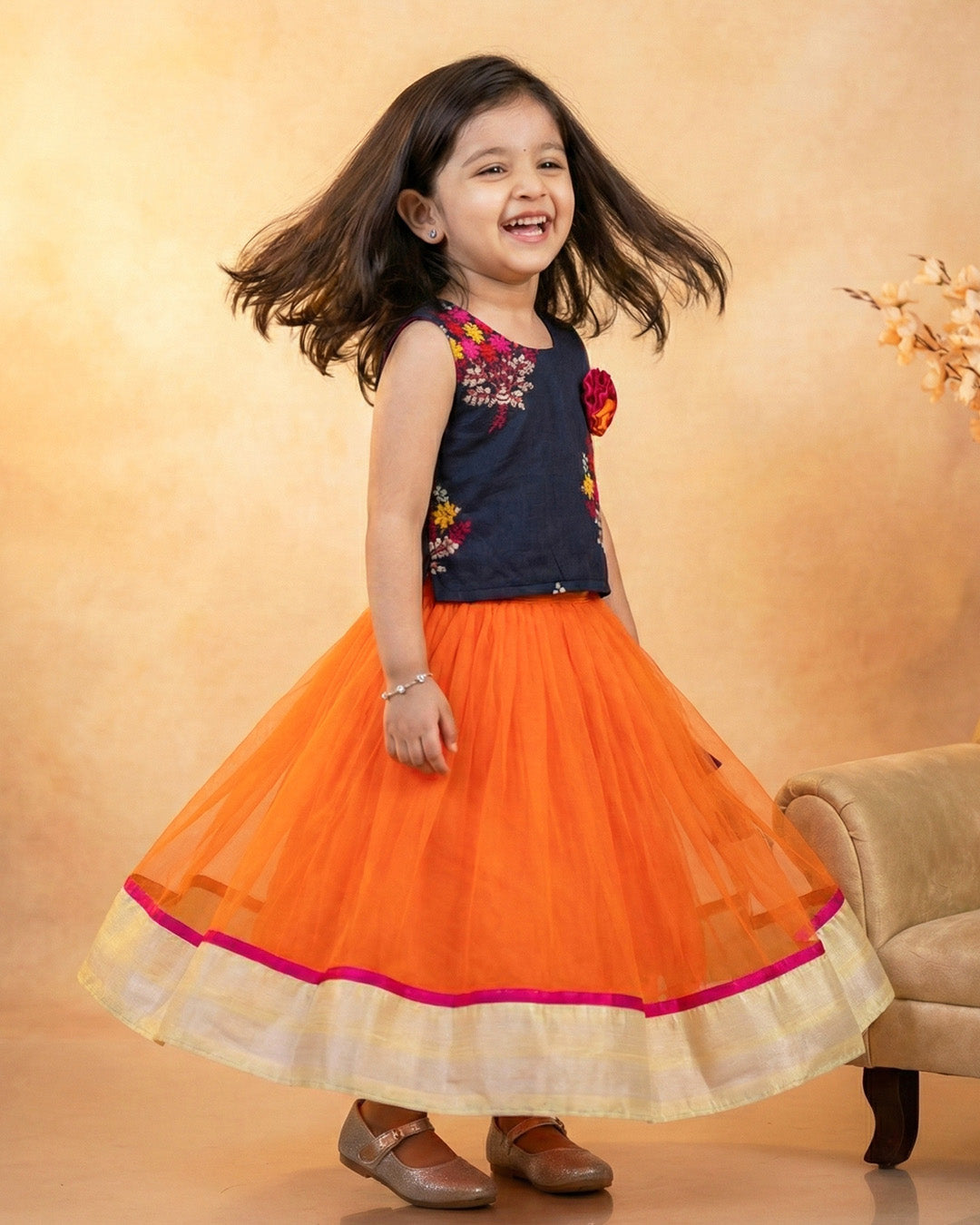 Orange and black combo lehenga choli set for baby girls

Traditional birthday dress for girls

Baby girls festive wear lehenga

Stylish ethnic dress for toddlers

Black orange designer lehenga for baby girls

Kids partywear traditional dress

Stanwells Kids ethnic birthday outfit