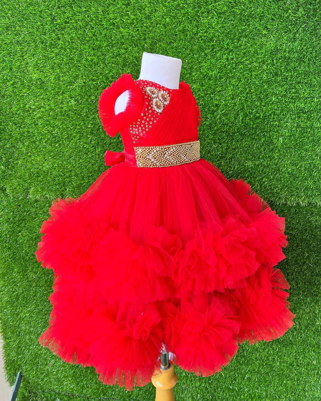 Red Layered Pleated Heavy Ruffled Hand embroidery Birthday Frock

Material: Bright red nylon mono net with layered and ruffles on the end portion. Yoke portion is designed with pleated pattern and a handwork in the centre portion