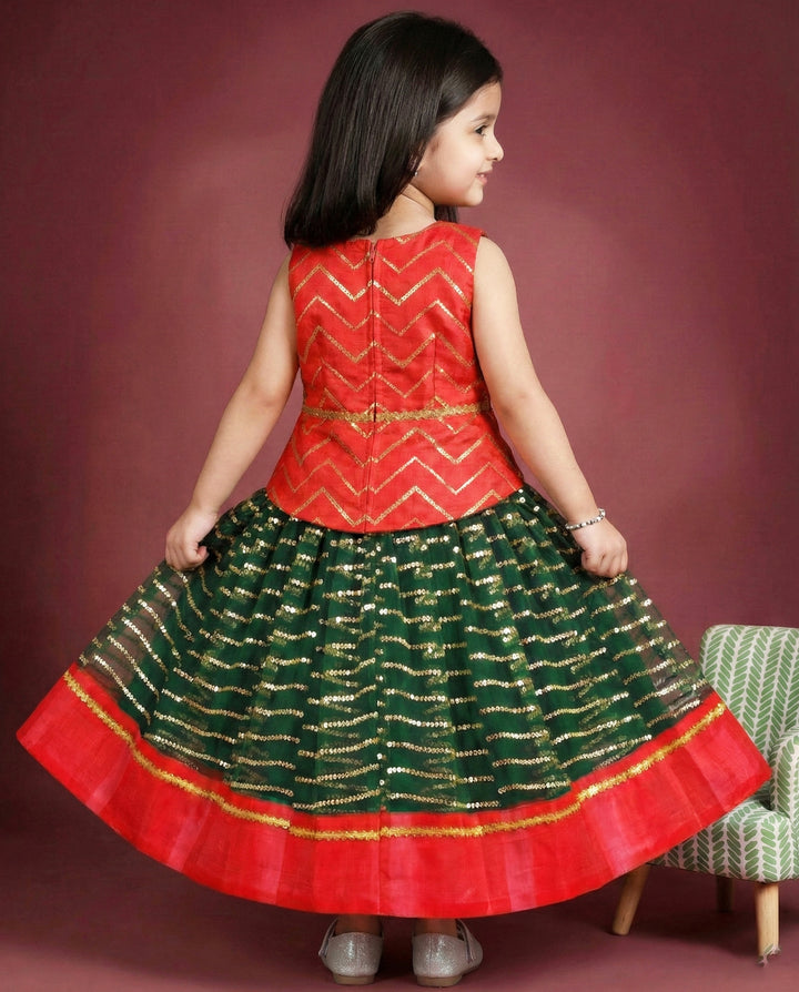 Bottle green and red sequin embroidery lehenga choli for baby girls

Traditional South Indian birthday dress for girls

Embroidered festive wear lehenga for toddlers

Designer sequin work partywear dress for kids

Baby girls ethnic lehenga choli set

Stanwells Kids festive birthday outfit

Green red designer lehenga for baby girls