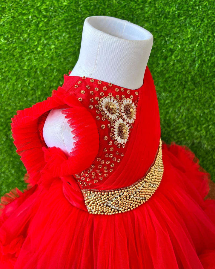 Red Layered Pleated Heavy Ruffled Hand embroidery Birthday Frock

Material: Bright red nylon mono net with layered and ruffles on the end portion. Yoke portion is designed with pleated pattern and a handwork in the centre portion