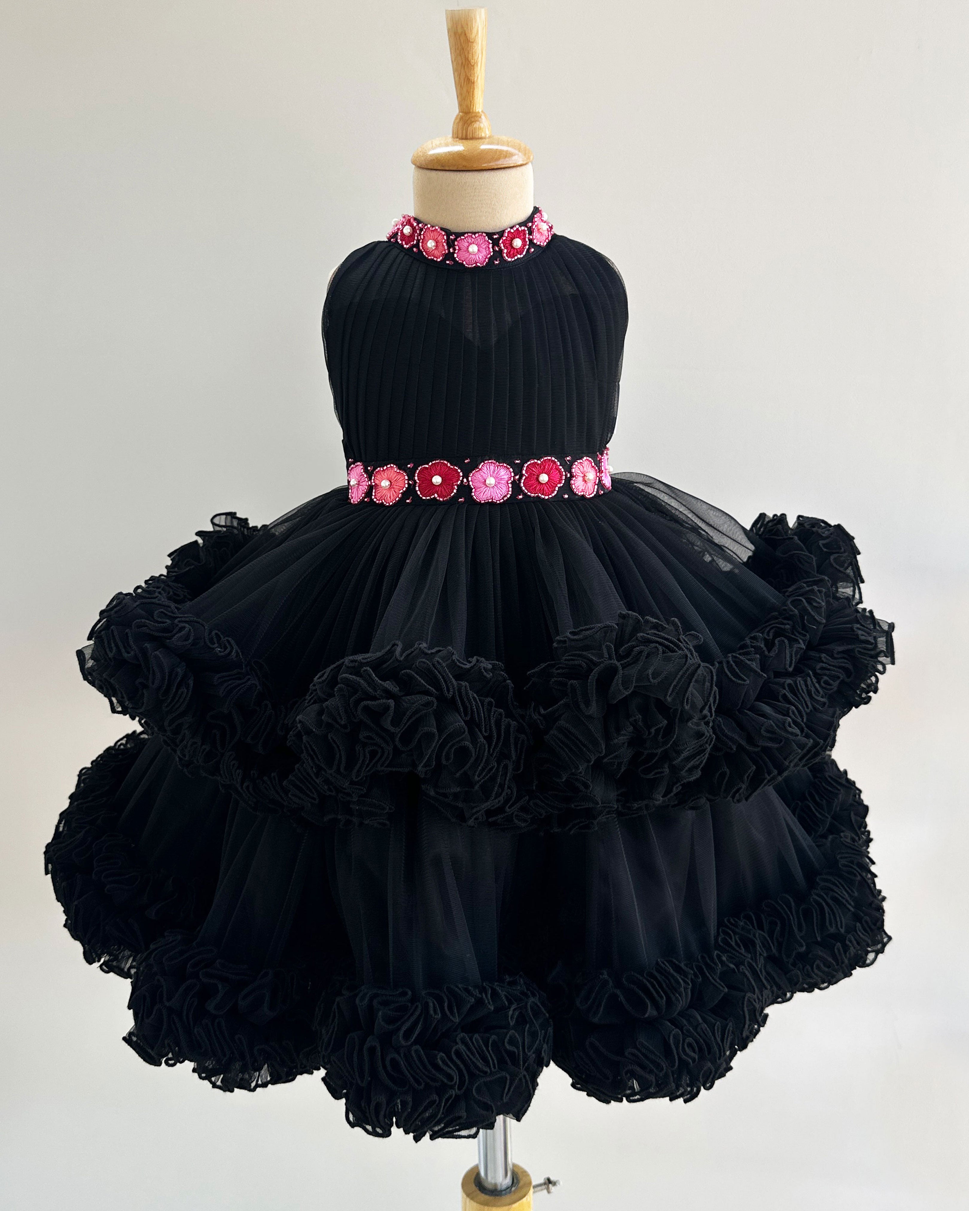 Black halter neck baby girl birthday frock

Hand-embroidered toddler party dress

2-step layered black birthday frock

Elegant black frock for baby girls

Stylish halter neck baby dress​

