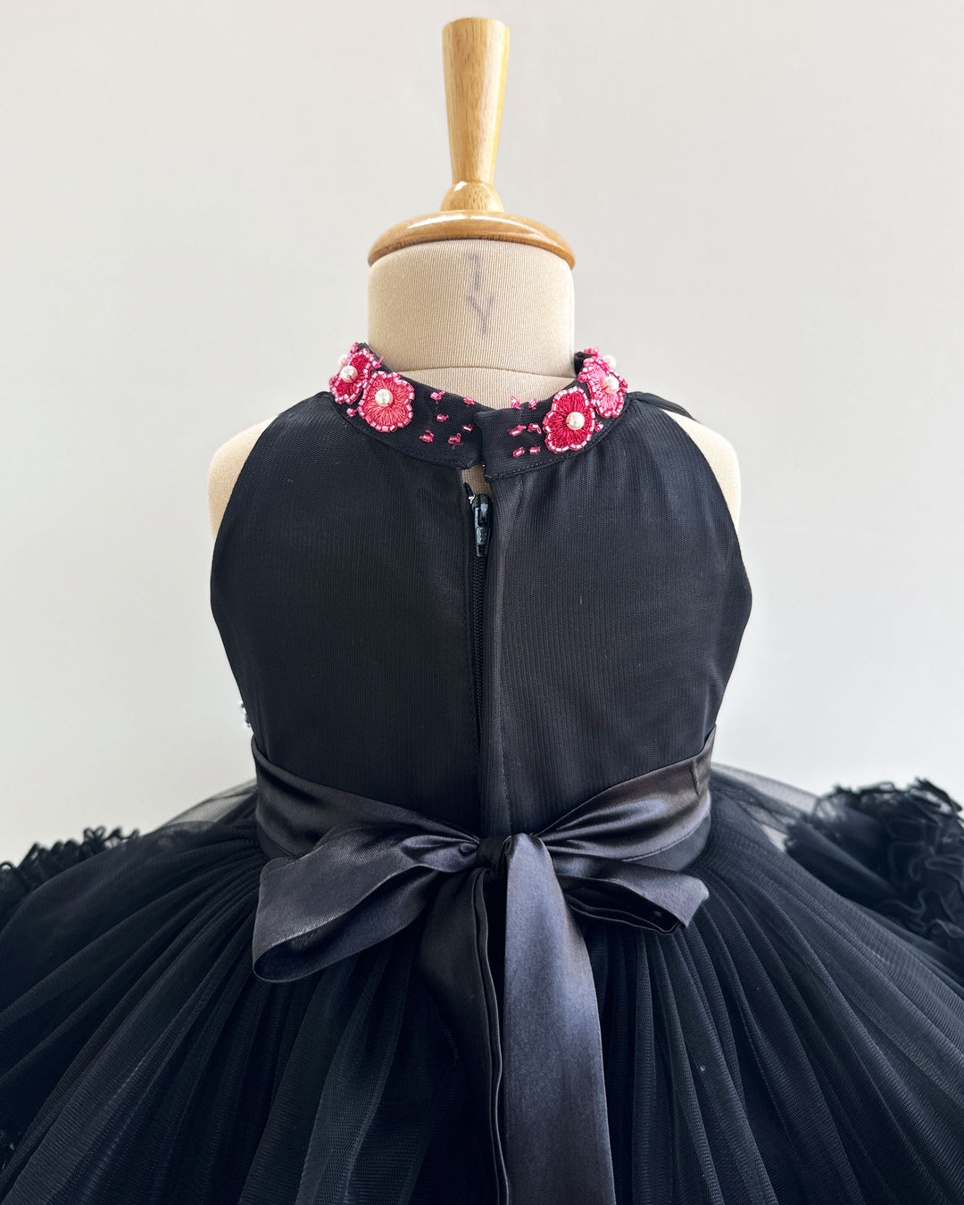 Black halter neck baby girl birthday frock

Hand-embroidered toddler party dress

2-step layered black birthday frock

Elegant black frock for baby girls

Stylish halter neck baby dress​

