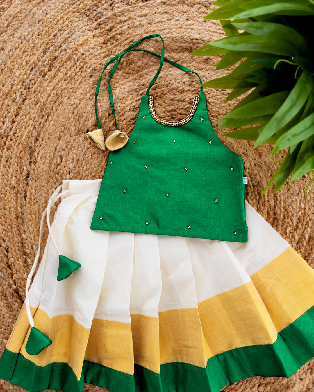 Cream green traditional Kerala Kasavu Onam lehenga choli for baby girl by Stanwells Kids, perfect for Onam, Vishu, and festive occasions.
