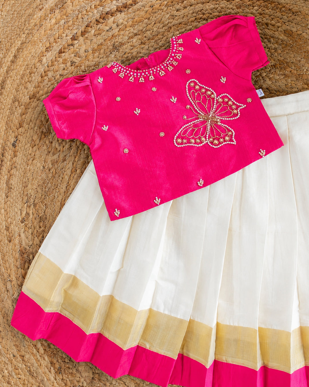 Butterfly handwork detail on pink taffeta silk blouse of cream pink lehenga – Stanwells Kids