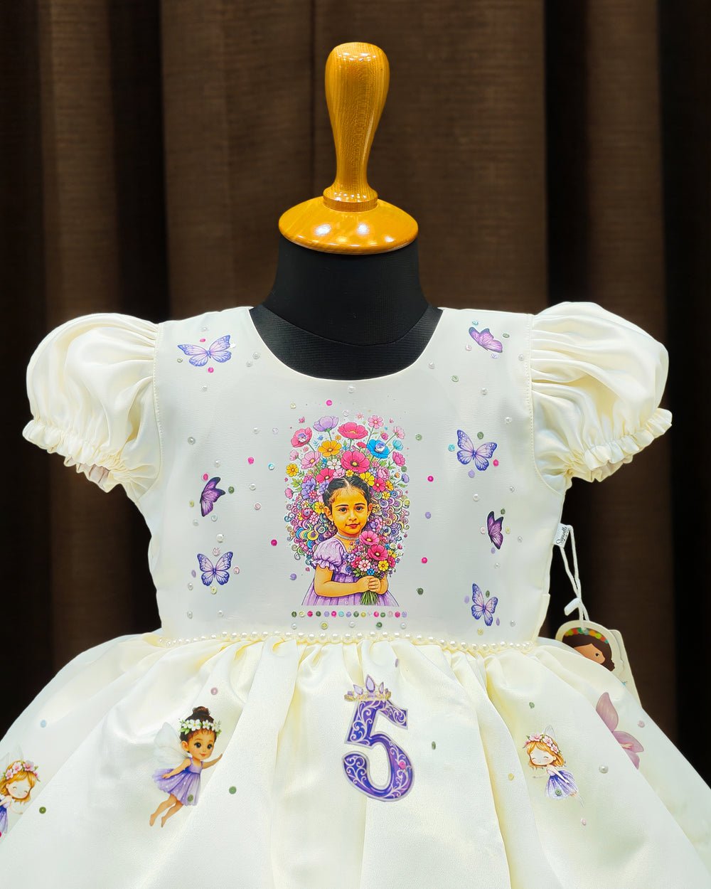 Custom fairy theme photo print detail on cream satin birthday frock – Stanwells Kids