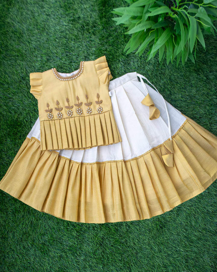 Cream and gold Kerala handloom Onam handwork lehenga choli for baby girl – front view, Stanwells Kids